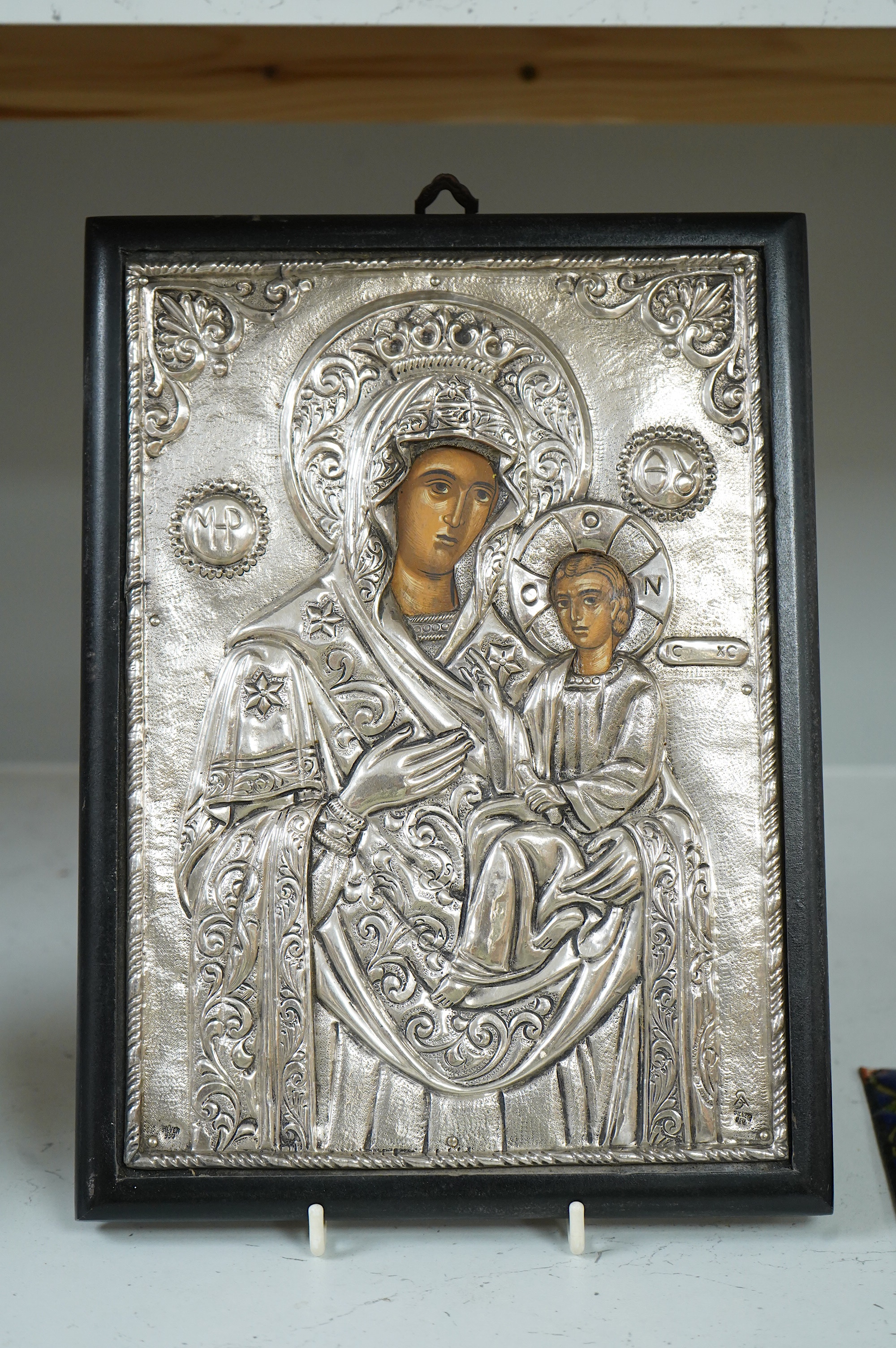 A Greek silver Icon Madonna and child, the oklad stamped silver 950, and a smaller similar enamel panel on copper, icon 31cm high